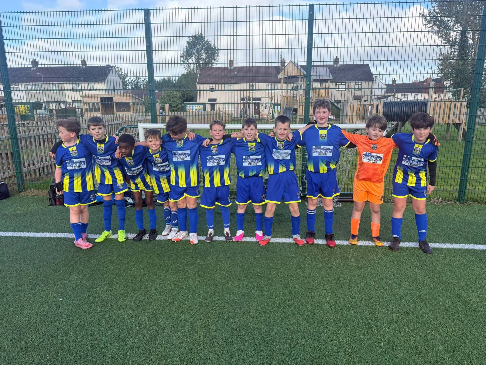 Lisburn Rangers boys’ academy team together in blue and yellow kits